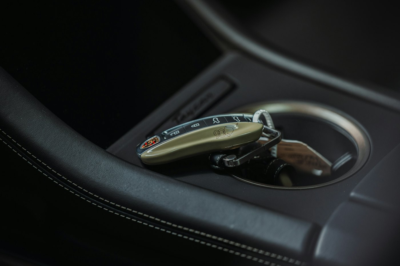 A smart key resting in a car's centre console